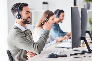 Image showing Man, call center and working in team office with headset, computer for online customer support, service or help. Businessman, employee and job in crm, telemarketing or communication help desk