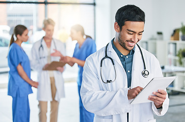 Image showing Smile, doctor and tablet with man in hospital for digital report, networking and medical research. Medicine, healthcare and app with male physician in clinic for technology, results and internet