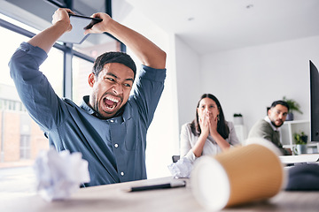 Image showing Angry, hitting and business man in office for anger management problem, mental health and frustrated. Shout, technology and burnout or stress of professional person with employees fear and shocked