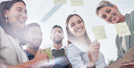 Image showing Planning, writing and business people on glass board for teamwork, brainstorming and schedule or workflow notes. Happy women, manager and group or team with sticky note ideas, solution and window