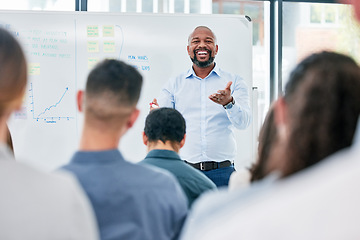 Image showing Business, coach and presentation with employees for a seminar with explanation and smile. Speaker, professional and corporate team for training or learning at a meeting with audience for discussion.