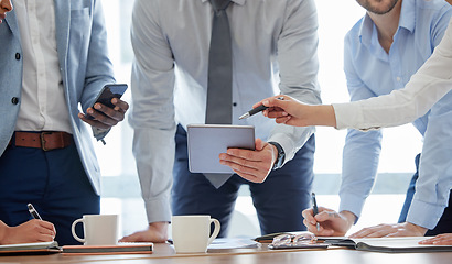 Image showing Closeup, business people and team brainstorming, technology and digital planning for collaboration. Group, coworkers and staff share ideas, discussion and online reading in a meeting, target and goal