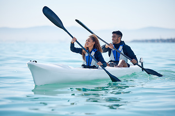 Image showing Kayak, couple and rowing boat on lake, ocean or river for water sports and fitness challenge. Man and woman with a paddle for adventure, exercise or travel in nature with freedom, energy and teamwork