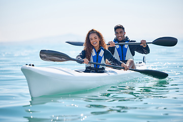 Image showing Kayak, rowing boat and couple on a lake, ocean or river for water sports and fitness challenge. Portrait of man and woman with a paddle and smile for adventure, teamwork exercise or travel in nature