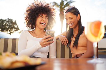 Image showing Funny, women and friends with drinks, phone and laughing with happiness, relax and social media. Female people, customers and girls with a smartphone, humor and connection with cocktails and chatting