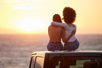 Image showing Love, gay and sunset with lesbian couple on car beach for relax, romance and sky mockup space. Lgbtq, freedom and pride with women hugging on nature date for partner, trust and summer vacation