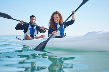 Image showing Couple, kayak and rowing boat on a lake, ocean or river for water sports and fitness challenge. Portrait of happy man and woman with a paddle for adventure, exercise or travel in nature with teamwork