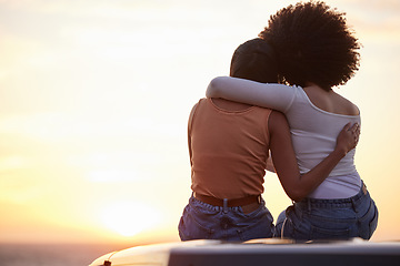 Image showing Love, hug and sunset with lesbian couple at beach for relax, romance and sky mockup space. Lgbtq, freedom and pride with women hugging on nature date for partner, trust and summer vacation