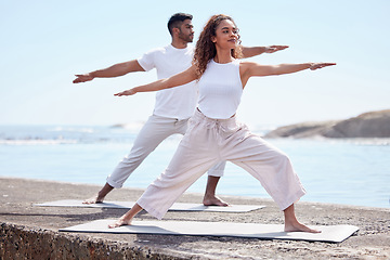 Image showing Couple yoga, beach and exercise outdoor in nature for fitness workout and wellness. African woman and a man at ocean for warrior pose, stretching or pilates training for peace, freedom or mindfulness