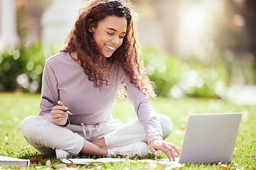 Image showing Woman sitting on lawn, laptop and college student on campus, studying with course material and education. Happy female person outdoor, learning and study online notes on pc with academic scholarship