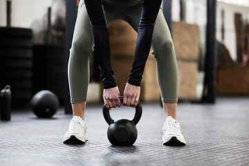 Image showing Kettle bell, fitness and woman in gym for weightlifting, bodybuilder training and strong muscles. Healthy body, weights and hands of female person in sport center for wellness, exercise and workout