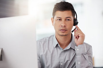 Image showing Businessman, call center and headphones in customer service, support or telemarketing at the office. Man consultant or agent with headset for online advice or telesales in contact us at the workplace