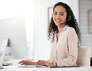 Image showing Portrait, call center woman and agent working on computer in an office, startup or telemarketing company. Happy, person and job in customer service, support or consulting work, crm or communication