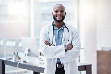 Image showing Doctor, portrait of a black man with his arms crossed and in his office at his workplace with a lens flare. Confident or proud, happy and male scientist or surgeon with arm folded in a laboratory