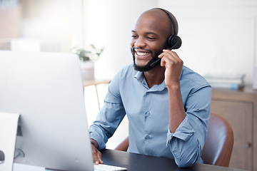 Image showing Black man, callcenter with phone call and contact us, communication with headset and CRM in office. Male consultant at computer, customer service or telemarketing, tech support and help desk worker