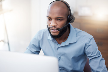 Image showing Black man, call center employee and CRM with contact us, communication and computer, headset with mic and connect. Male consultant, customer service and tech support with help desk worker in office