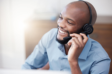 Image showing Call center, black man and happy agent working on computer in the office, business in telemarketing or customer service. Businessman, face with smile and crm, conversation with client on help desk