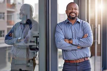 Image showing Happy, portrait of black businessman with arms crossed and at office building outside with a lens flare. Happiness, good news and confident or cheerful African male person outdoors of workplace