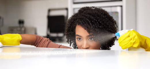 Image showing Cleaning, spray and table with woman in kitchen for hygiene, disinfectant or sanitary. Safety, germ and bacteria with female cleaner and washing furniture in apartment home for housework and chemical