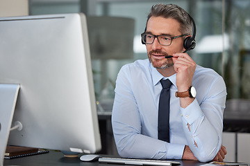 Image showing Businessman, call center and headphones on computer for customer service, telemarketing or support at office. Man, consultant or agent consulting on PC for online advice or telesales at the workplace