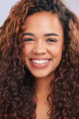 Image showing Woman, natural hair and curly hairstyle in studio with smile and glow. Face portrait of African person with beauty and healthy curls as benefits or results of shampoo or cosmetics on white background