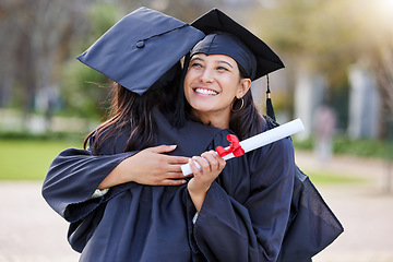 Image showing Graduate, education and woman friends hugging at a university event on campus for celebration. Graduation, certificate and hug with female students together in support of a scholarship achievement