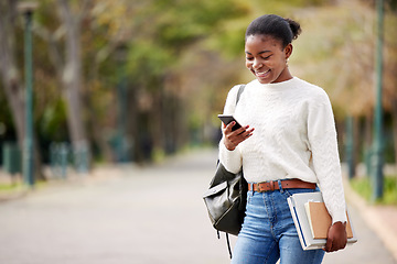 Image showing Phone, books and mockup with a student black woman on her commute to university campus for education. Mobile, social media and schedule with a female college pupil checking for her next lecture