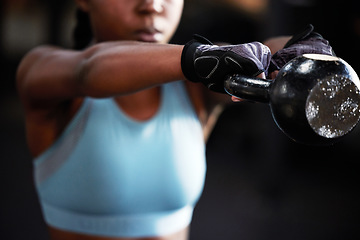 Image showing Hands, kettlebell or strong woman in fitness training, workout or bodybuilding exercise for grip strength power. Body builder, blurry closeup or female sports athlete at gym lifting heavy weights