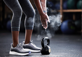 Image showing Fitness, kettlebell or hands of woman with powder to start training, workout or exercise for grip strength. Body builder, floor or healthy athlete with chalk dust at gym ready for lifting weights