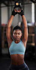 Image showing Fitness, kettlebell or portrait of black woman in training, workout or bodybuilding exercise for grip. Body builder, girl power or strong sports athlete with at gym to start lifting heavy weights