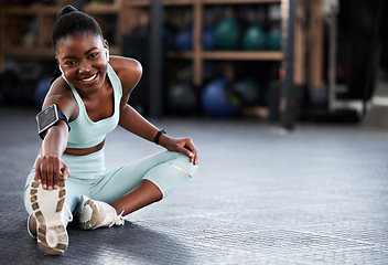 Image showing Music, portrait or black woman in gym stretching legs for workout routine or body movement for fitness. Happy, headphones or healthy girl athlete smiling in exercise training warm up for flexibility