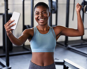 Image showing Gym, flexing or happy girl taking selfie on workout, exercise or training break on social media for results. Proud influencer, strong or black woman smiling for pictures or online fitness content