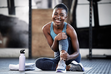 Image showing Relax, portrait or happy black woman at gym for a workout, exercise or training for healthy body or fitness. Face of sports girl or African athlete smiling or relaxing on break with positive mindset