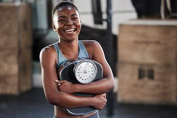 Image showing Fitness, portrait or happy black woman with a scale after body training or gym workout to lose weight. Wellness, laughing or funny girl athlete in health club for exercising progress or results