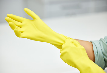 Image showing Hands, cleaning and latex gloves for safety or hygiene while indoor for chores or housework as a maid. Bacteria, service and rubber with a cleaner or janitor getting ready for housekeeping duties