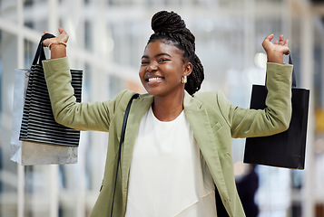 Image showing Black woman, portrait smile and shopping bag for payment, discount or sale at retail store or mall. Face of happy African female person or shopper smiling with gift bags, buy products or purchase