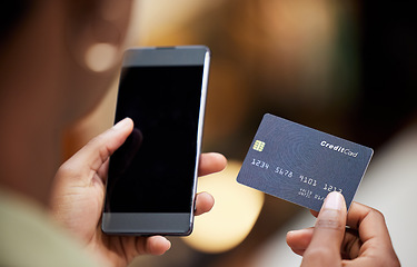 Image showing Hands, credit card and smartphone for online shopping, woman or blank screen for discount, sale or deal. Girl, phone and fintech for payment, retail ecommerce and cybersecurity for safety on internet