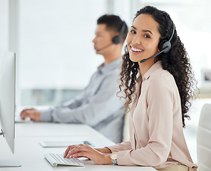 Image showing Call center, smile and portrait of a woman at a computer for online support, advice or communication. Happy, contact us and a customer care employee typing on a pc for telemarketing consultation