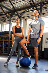 Image showing Fitness, gym and portrait of a man and woman with a medicine ball for training, workout or class. Couple of friends as client person and personal trainer at a health and wellness club for exercise