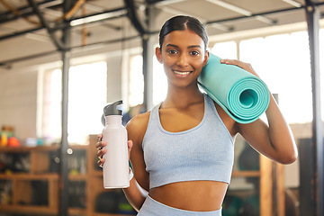 Image showing Mat, portrait or Indian woman with water in gym ready for training, workout or exercise with smile. Fitness, athlete smiling or happy girl with bottle for healthy liquid hydration to start exercising