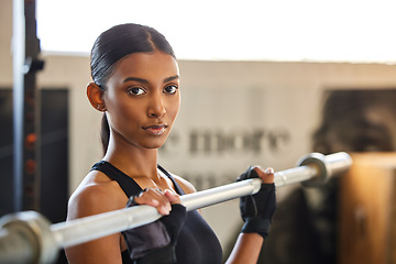 Image showing Portrait, Indian woman or bodybuilder with barbell in fitness training, workout or exercise for body building. Strong girl, mindset or healthy athlete weightlifting powerlifting with focus at gym