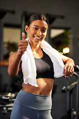 Image showing Gym, portrait or happy woman with thumbs up in fitness training with positive mindset or motivation. Wellness, smile or healthy female personal trainer in workout with like hand gesture or thumb up