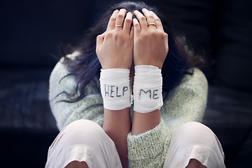 Image showing Wrist, depression and woman with help on bandage for suicide, self harm or person in dark mental health crisis. Bandages, girl and injury from depressed accident, problem or mistake in cutting wrists