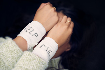 Image showing Woman, depression and wrist with help on bandage for suicide, self harm or person in dark mental health crisis. Bandages, girl and injury from depressed accident, problem or mistake in cutting wrists