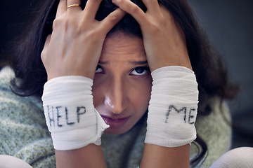 Image showing Depression, wrist and woman with help on bandage for suicide, self harm or person in dark mental health crisis. Portrait, girl and injury from depressed accident, problem or mistake in cutting wrists