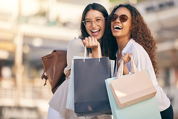 Image showing Portrait, shopping or women with bags, city or retail with boutique items, buyers or fashion. Face, female customer or friends with discount, sales or consumer choice with happiness, funny or outdoor