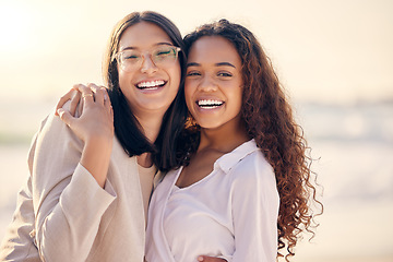 Image showing Portrait, lesbian and women hug, beach and love with freedom, equality and romance with happiness. Face, couple and girls embrace, lgbtq relationship and commitment with pride and seaside vacation