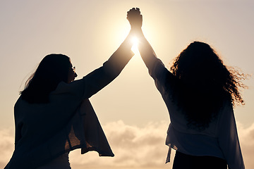 Image showing Back silhouette, sunshine and women holding hands for support, success and love in nature. Happy, dark and friends with solidarity, trust and unity on a holiday for friendship or bonding together