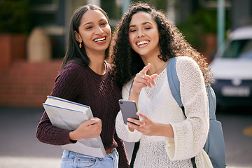 Image showing Phone, college and female students networking on social media, mobile app or the internet. Happy, smile and women friends reading information on online website standing outdoors on university campus.