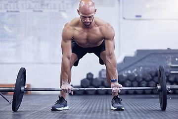 Image showing Male athlete, fitness and deadlift at the gym for muscles for a strong body for sport with motivation. Workout, barbell and man is training at a club for exercise with strength for weightlifting.